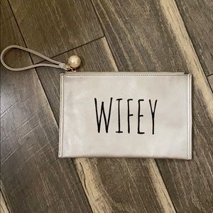 Deux Lux “wifey” silver wrist clutch